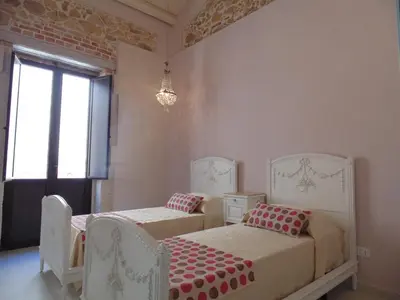 Letto o letti in una camera di Allegrakori
