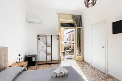 Letto o letti in una camera di Le Torrette Rooms and Apartments