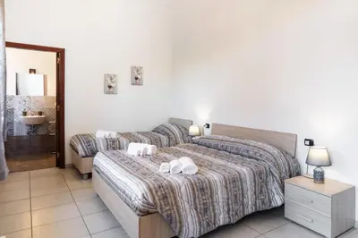 Letto o letti in una camera di Le Torrette Rooms and Apartments
