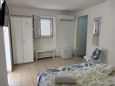 Letto o letti in una camera di Le Torrette Rooms and Apartments