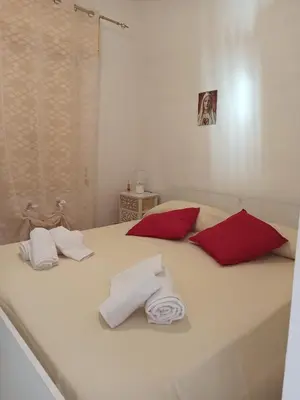 Letto o letti in una camera di Villetta Tea immersa nel verde