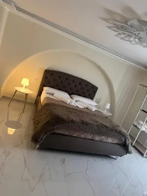 Letto o letti in una camera di Lombardo House