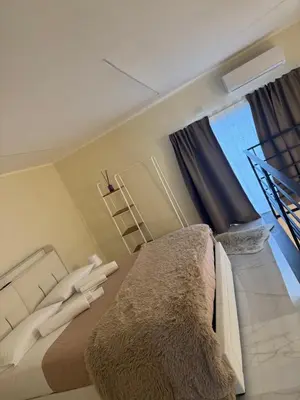 Letto o letti in una camera di Lombardo House