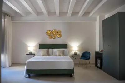 Letto o letti in una camera di Luxury B&B Maison Madre in the historic center of Avola