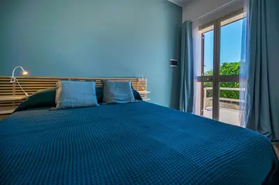 Letto o letti in una camera di Miramare Exclusive Prestige