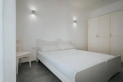 Letto o letti in una camera di Miramare