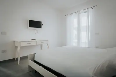 Letto o letti in una camera di Miramare
