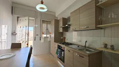 Cucina o angolo cottura di Aura Lucis, Elegant apt for 8, parking, Wi-Fi
