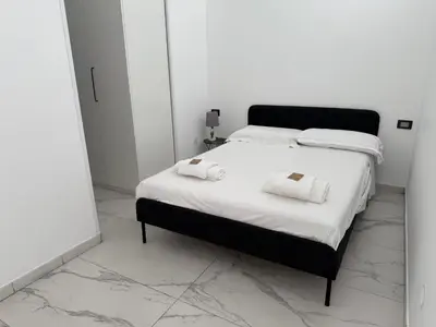 Letto o letti in una camera di In home 44