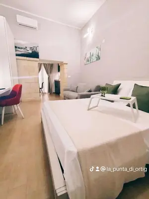 Letto o letti in una camera di La Punta di Ortigia