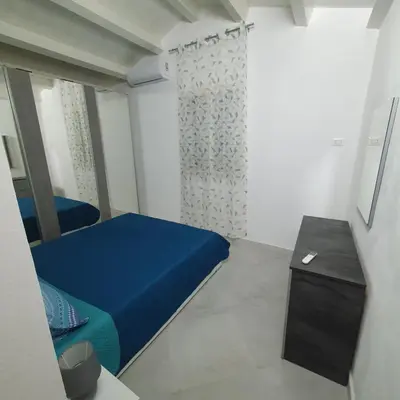 Letto o letti in una camera di Casa via maucini