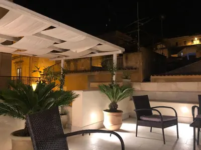Area soggiorno di Charming 2-Bedroom House - Rooftop terrace in Heart of Noto, Sicily