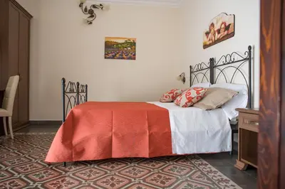 Letto o letti in una camera di B&B Palazzo Tornabene