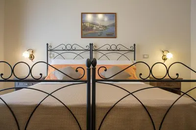 Letto o letti in una camera di B&B Palazzo Tornabene