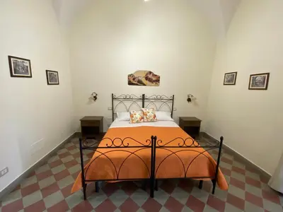 Letto o letti in una camera di B&B Palazzo Tornabene
