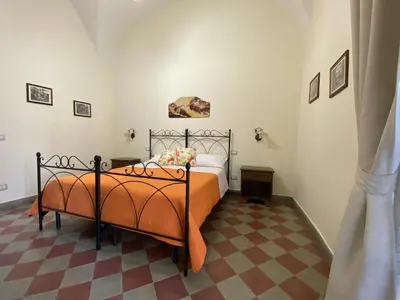 Letto o letti in una camera di B&B Palazzo Tornabene