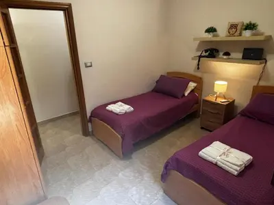 Letto o letti in una camera di Casa del Collegio