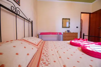Letto o letti in una camera di Villa Marinella