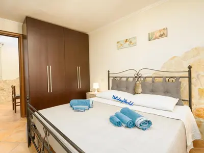Letto o letti in una camera di Casa Domiziano by Holiday World