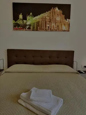Letto o letti in una camera di Borgo Sant Agata