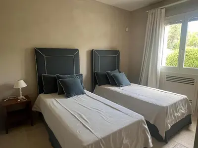Letto o letti in una camera di Villa Heron Sicily