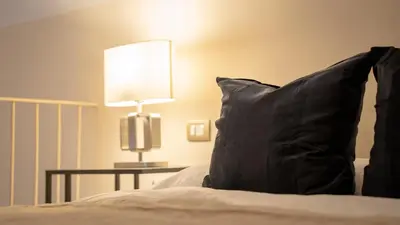 Letto o letti in una camera di La Dimora al Duomo - Elegant Historic Stay in Centro Catania by Duomo