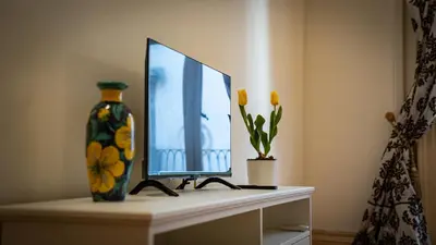 TV o dispositivi per l'intrattenimento presso La Dimora al Duomo - Elegant Historic Stay in Centro Catania by Duomo