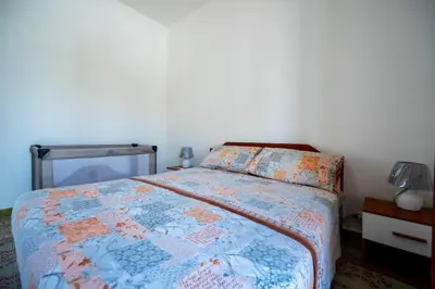 Letto o letti in una camera di Villa Mandaré - Fontane Bianche
