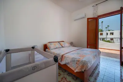 Letto o letti in una camera di Villa Mandaré - Fontane Bianche