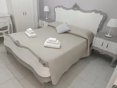 Letto o letti in una camera di Sicilia Bedda House
