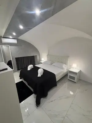 Letto o letti in una camera di La 75 Stella Home Catania