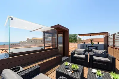 Area soggiorno di Lucea Sea Terrace by Ortigiapartments