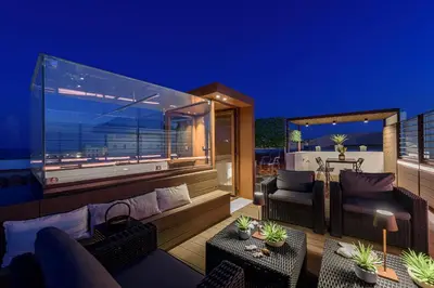 Area soggiorno di Lucea Sea Terrace by Ortigiapartments