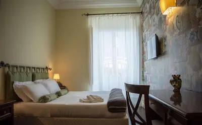 Letto o letti in una camera di Il Duomo Relais