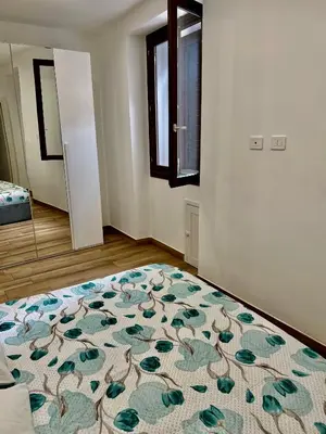 Letto o letti in una camera di Menotti Appartment