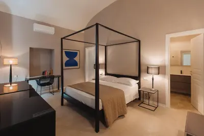 Letto o letti in una camera di Dimora Crocefisso