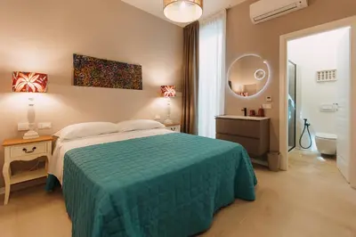 Letto o letti in una camera di Dimora Crocefisso