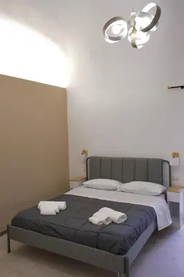 Letto o letti in una camera di Civico Venti Catania