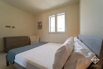 Letto o letti in una camera di Portopalo Comfort Suite