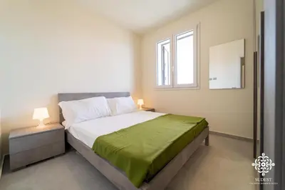 Letto o letti in una camera di Portopalo Comfort Suite