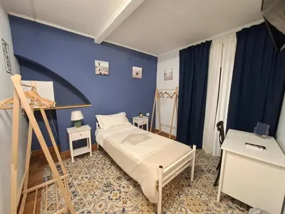 Letto o letti in una camera di B&B Piazza Mazzini