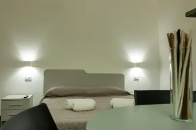 Letto o letti in una camera di Home & Relax