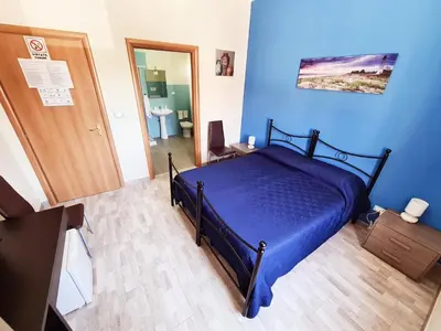 Letto o letti in una camera di Affittacamere Il Terrazzo Di Archimede
