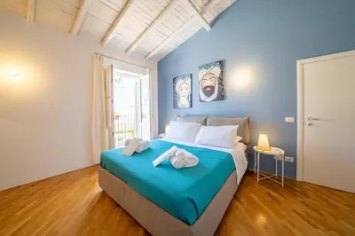 Letto o letti in una camera di Terrazza panoramica nell'anima storica di Ortigia