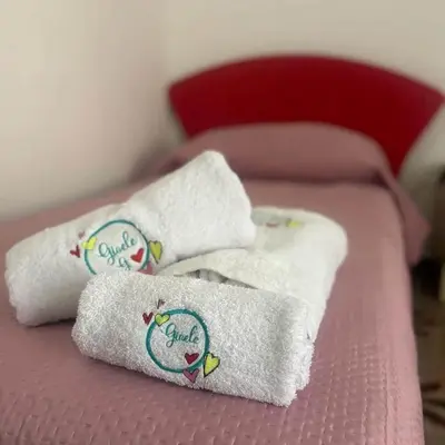 Letto o letti in una camera di Casa Gioele G