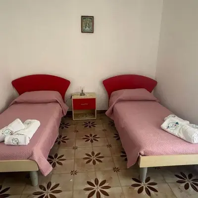 Letto o letti in una camera di Casa Gioele G