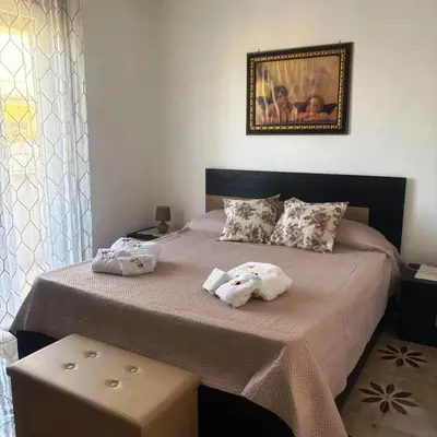 Letto o letti in una camera di Casa Gioele G