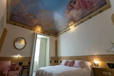 Letto o letti in una camera di Il cielo in una stanza