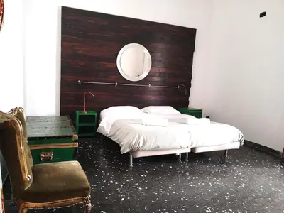 Letto o letti in una camera di Appartamento in centro con terrazzo per 11 persone