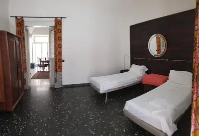 Letto o letti in una camera di Appartamento in centro con terrazzo per 11 persone